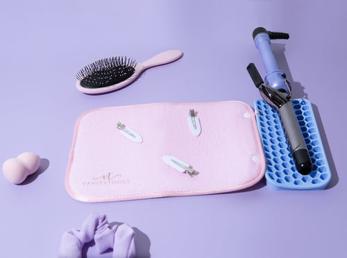 A vanity mat with a silicone holder for hot tools, displayed